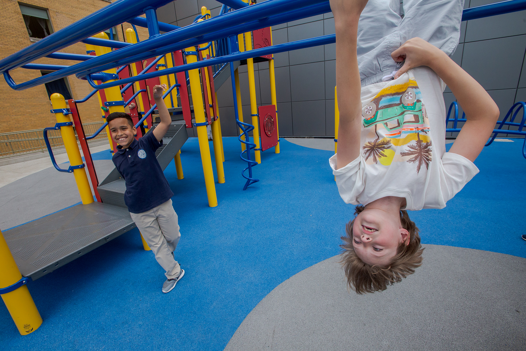 two kids playing on a playground